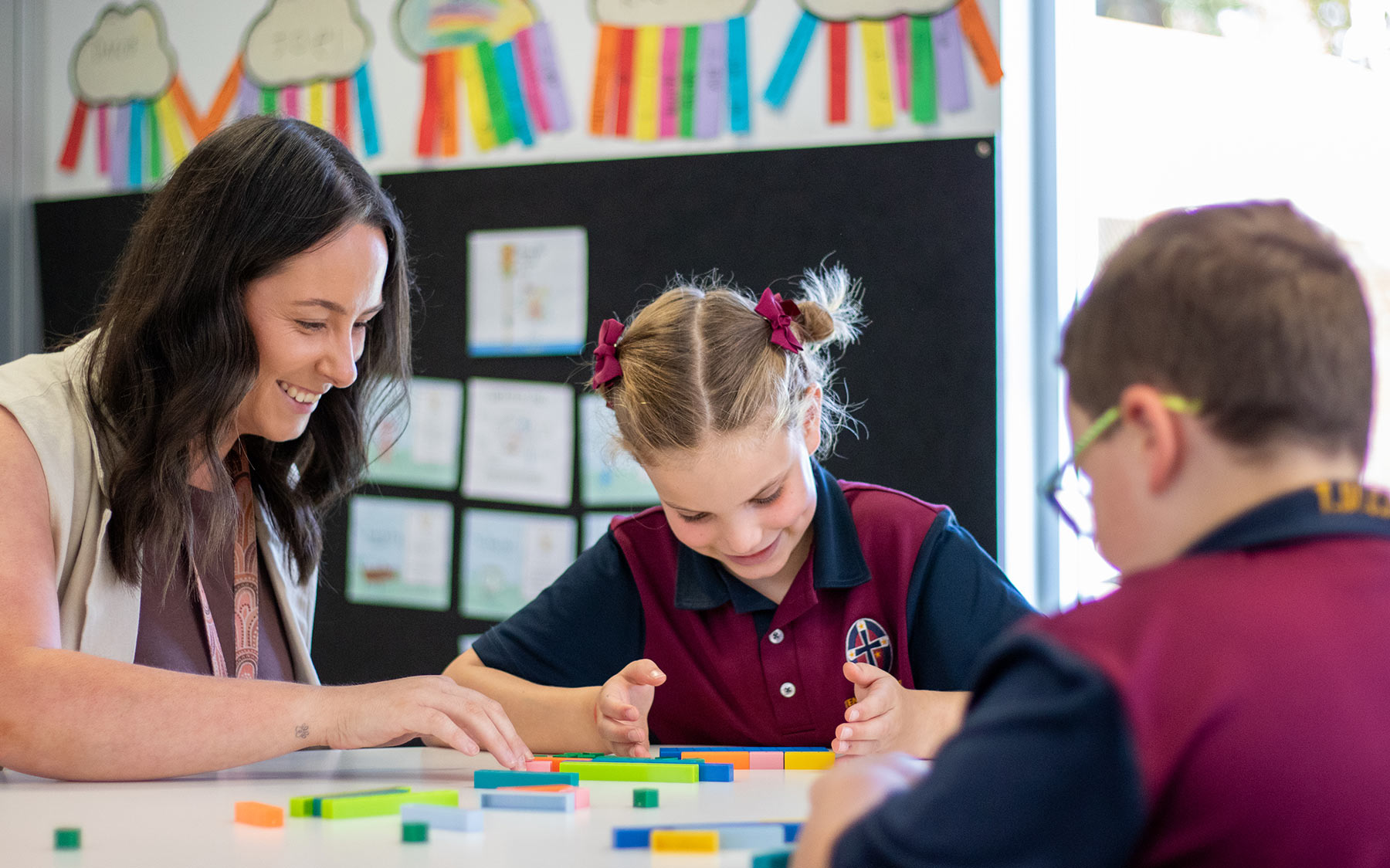 Teacher smiling with students