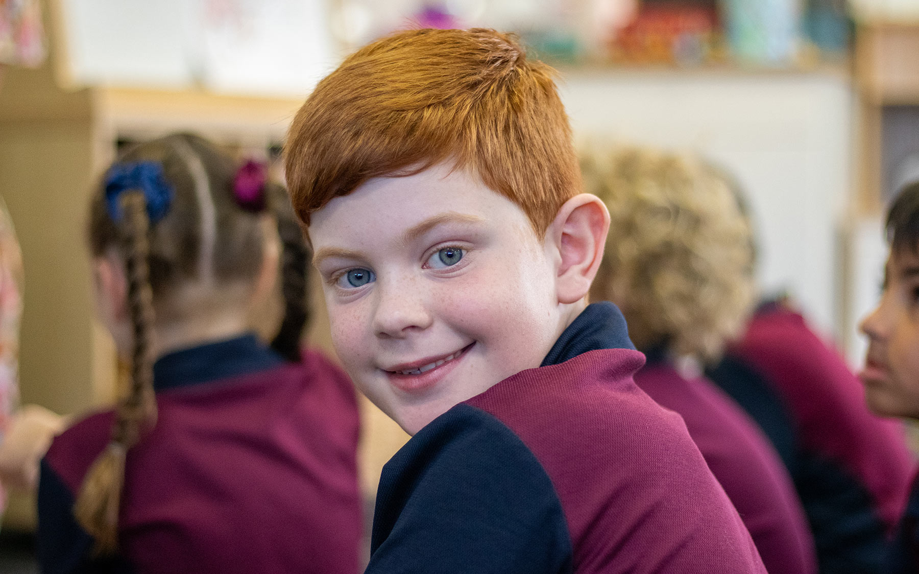 student-smiling-in-class-homepage_v2.jpg